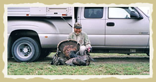 Tim Foster with a trophy bird after a successful turkey hunt